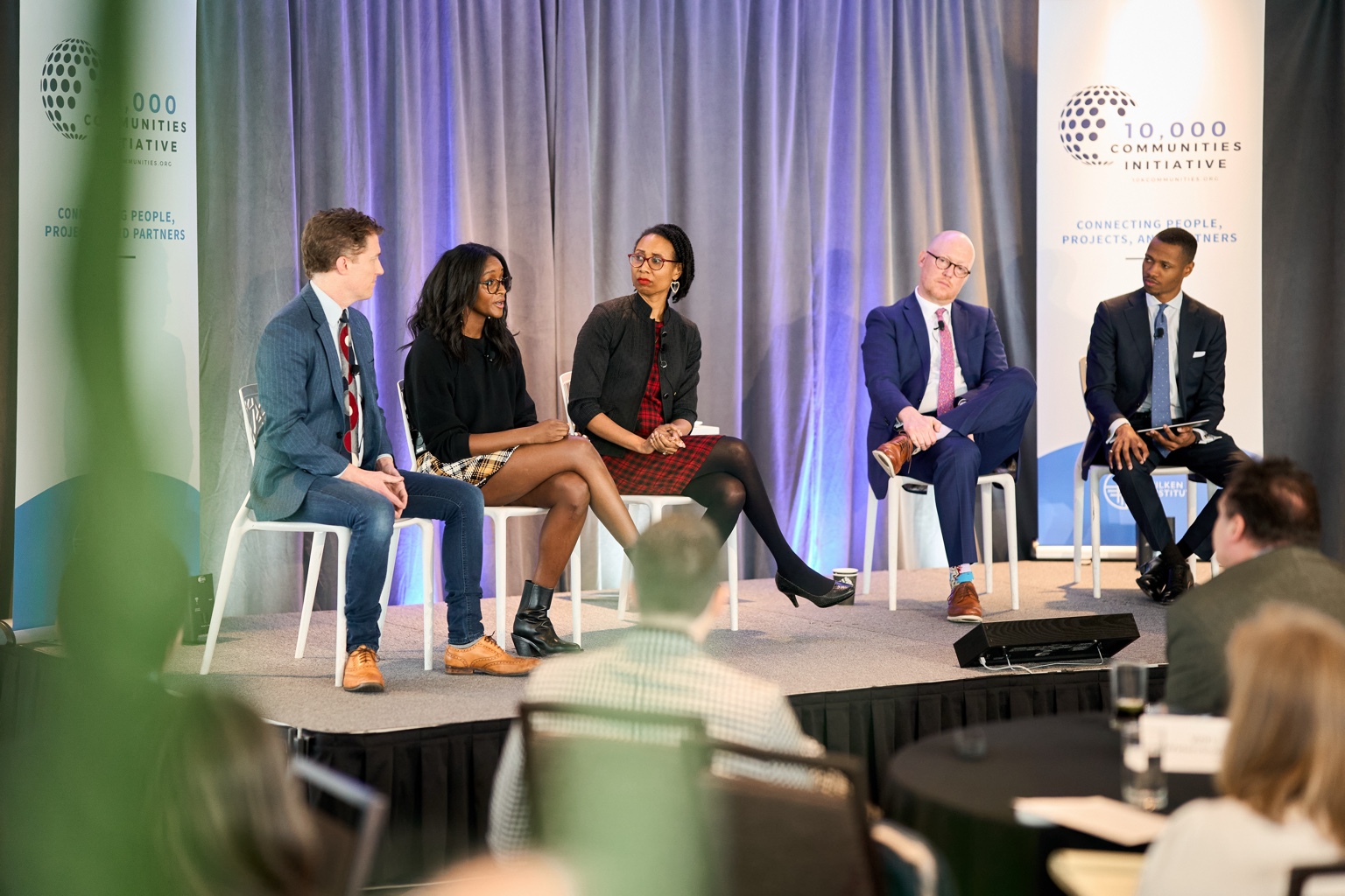 Troy Duffie moderating a panel at the 10,000 Communities Initiative